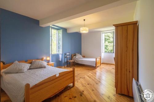 Ένα ή περισσότερα κρεβάτια σε δωμάτιο στο Maison Chez Caussade
