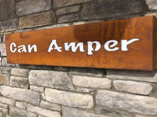 a sign that says can amyer on a brick wall at Chalet in Mühlbach near Hochkönig Ski Area in Mühlbach am Hochkönig
