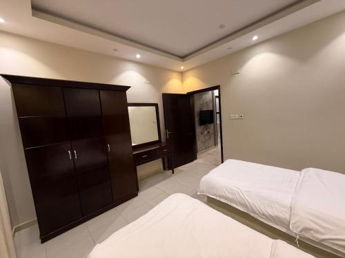Cama o camas de una habitación en نجوم القريات 2للاجنحة المخدومة