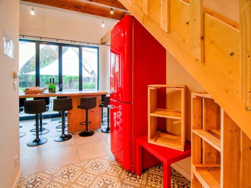 an old red refrigerator in a kitchen with a table at Bocholt Family Home, Bocholt in Bocholt
