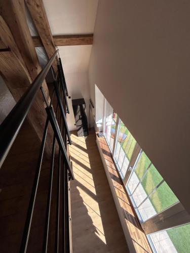 a staircase in a house with a window at Domaine du Crêt in Amplepuis