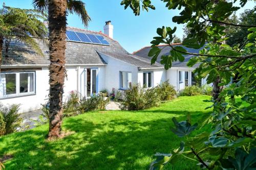 a house with solar panels on the roof at Hywelfa in Abersoch