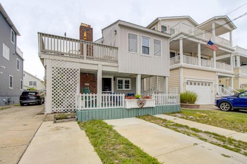 a large white house with a balcony on a street at Cozy Beach Getaway about 6 Mi to Atlantic City! in Brigantine