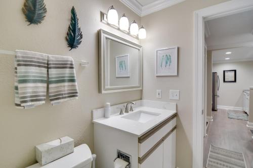 a white bathroom with a sink and a toilet at Harbor Springs Condo about 6 Mi to Lake Michigan! in Harbor Springs