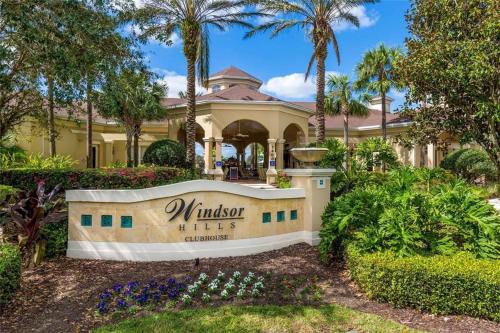 a mansion with a sign in front of a yard at 3 Bedroom Condo with Water Park & Fantastic Pool only Minutes To Walt Disney World's Front Gate!!! in Orlando