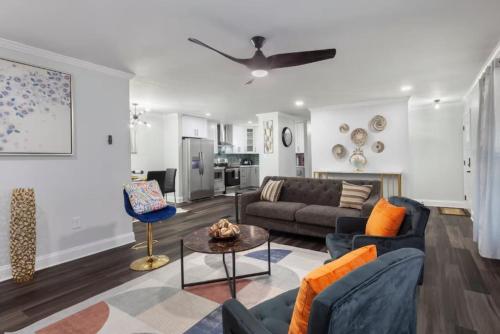 a living room with a couch and a table at Private Fenced Yard Near Truist Park and ATL in Marietta