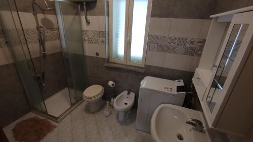 a bathroom with a shower and a toilet and a sink at ITALY-HOUSE Piviere 5 UP, Termoli, Molise in Termoli