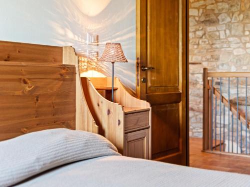 a bedroom with a bed and a desk with a lamp at Holiday Home in Ca' De' Grimaldi with Garden in Castellarano