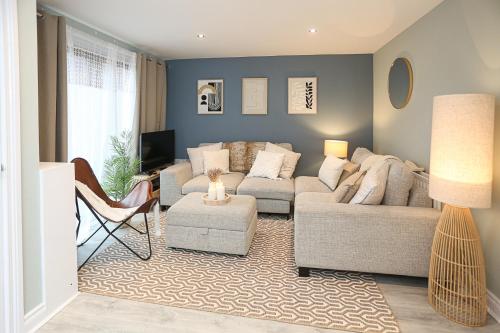 a living room with a couch and a table at Ardenlee Drive in Belfast