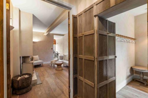 an open door into a room with a living room at Sanctuary House with Parking By My Getaways in Shoreham-by-Sea