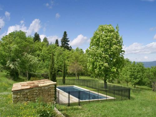 a swimming pool in a yard with a fence around it at Villa in Saignon with Pool and Scenic Views in Ménerbes