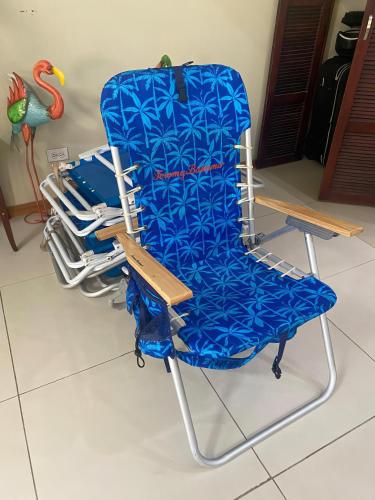 a blue chair sitting in a room at Aruba , Eagle Beach Townhouse in Palm-Eagle Beach