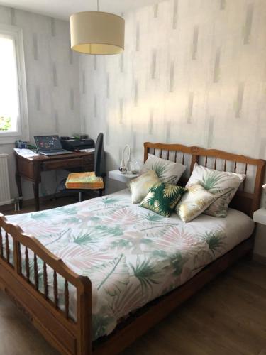 a bedroom with a bed with pillows and a piano at Françoise in La Celle-sous-Gouzon