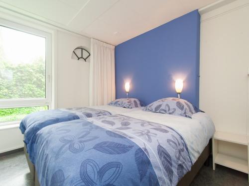 Ένα ή περισσότερα κρεβάτια σε δωμάτιο στο Farmhouse Stay near Dunes