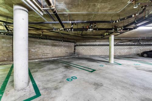 an empty parking garage with green paint on the floor at Ultra Lux Oasis in Gated Community in Irvine