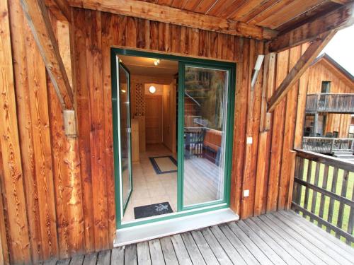 a screened in porch of a wooden house at Chalet in Stadl an der Mur near Ski Slopes in Stadl an der Mur