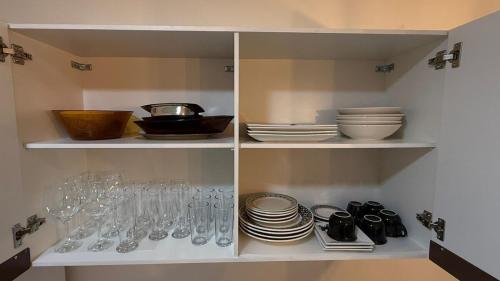 Η κουζίνα ή μικρή κουζίνα στο Casa nova e aconchegante em condomínio