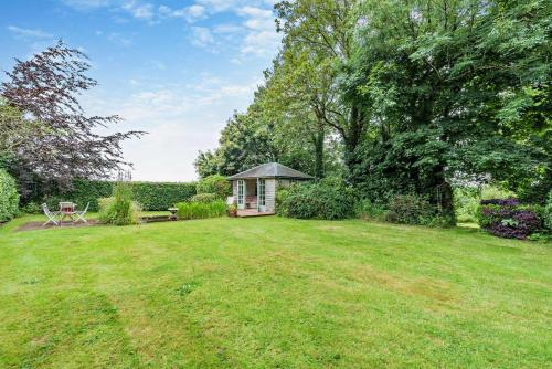 a gazebo in the middle of a yard at Cryngae in Felindre