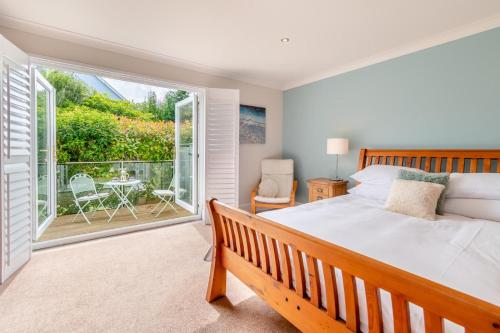 Voodi või voodid majutusasutuse Daisy Cottage - St Florence toas