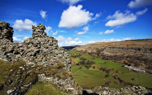 an old castle on the side of a mountain at Dee Mount in Carrog