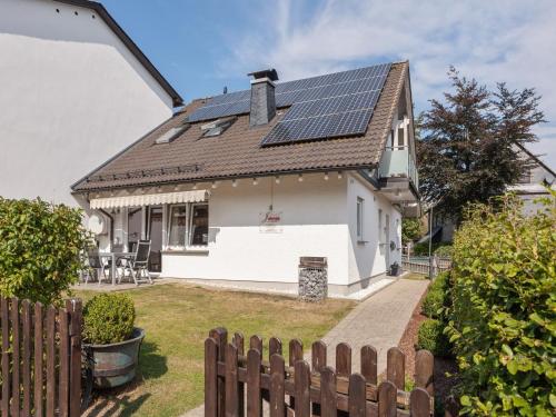 a house with solar panels on the roof at Entspannender Rückzugsort in Langewiese in Winterberg