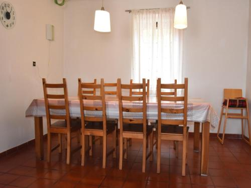 a dining room table with chairs and a table and a window at Holiday Home Abertamy near Ski Slopes in Abertamy