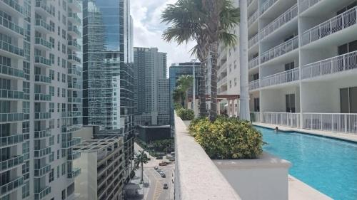a swimming pool in a city with tall buildings at Stunning view from 42nd floor, Brickell-Miami financial district free self-parking spot, sleeps 4 in Miami