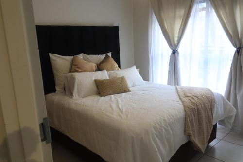 Postel nebo postele na pokoji v ubytování The Blyde Riverwalk Estate