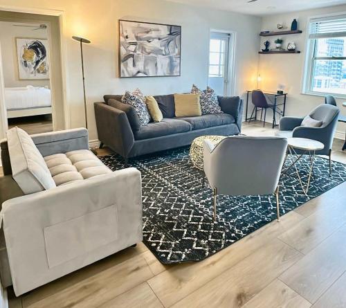 a living room with a couch and a table at City Views & Downtown Vibes Your Urban Oasis in Atlanta