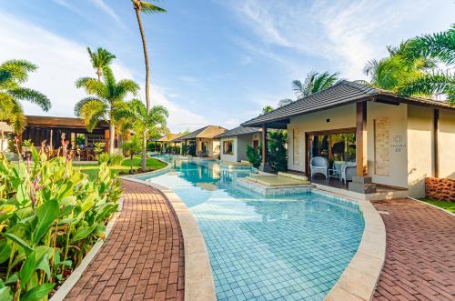 an image of a swimming pool at a villa at AWARA POUSADA BOUTIQUE in São Miguel do Gostoso