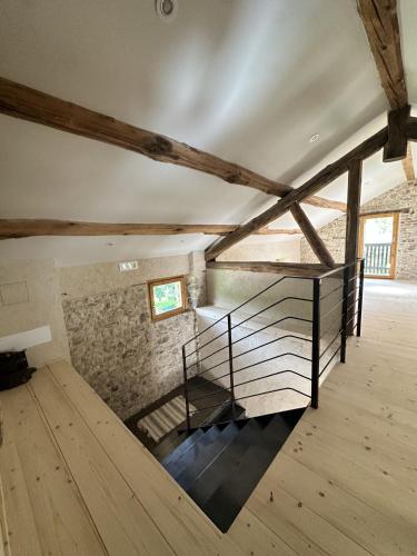 a room with a staircase in a building with wooden floors at La finestra sul grappa in Seren del Grappa