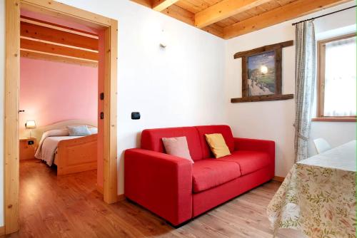 Ένα ή περισσότερα κρεβάτια σε δωμάτιο στο Chalet Dolomiti