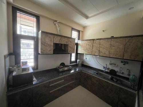 a kitchen with a sink and a counter top at The Roots of Jaipur Home stay in Jaipur