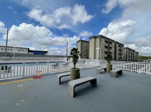 a view of a rooftop with benches and buildings at AP a 3KM das PRAIAS, com SUÍTE in São Luís