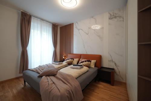 Ένα ή περισσότερα κρεβάτια σε δωμάτιο στο KEDA Royale Suite City Center Charm