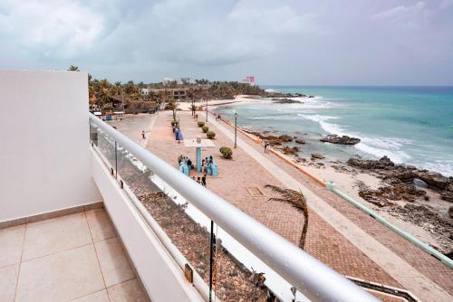 a view of the beach from a balcony at The Mint Resort Isla Mujeres in Isla Mujeres