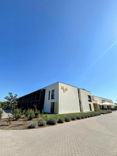 a building with a sign on the side of it at MDS Bonikowo in Bonikowo