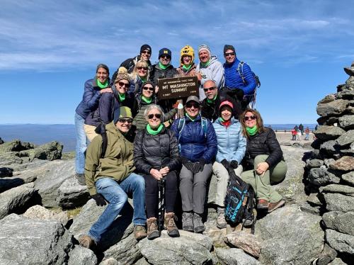a group of people posing for a picture on some rocks at CoHo: Conway Hostel in Conway
