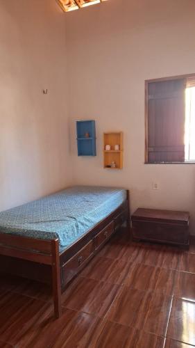 a bedroom with a bed in a room at Casa Beija Flor - Baleia Beach in Itapipoca