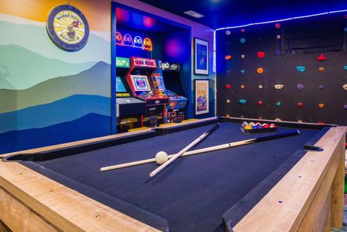 a pool table with cue balls on it in a room at Hawksbill Hideaway in McGaheysville