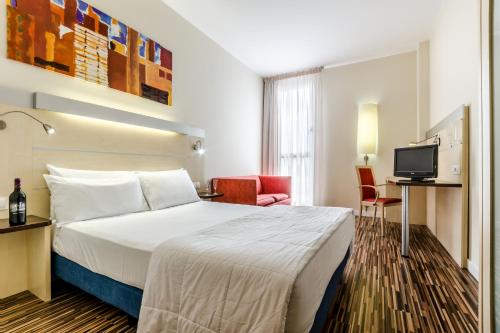 En eller flere senge i et værelse på Hotel YIT Ciudad De Zaragoza