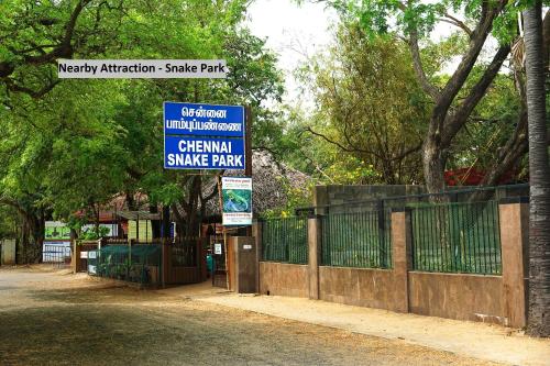 a sign for a skate park with a fence at Hotel O Nestle inn in Chennai