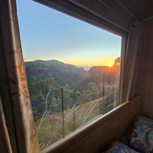 a window in a room with a view of the mountains at Green Discovery's Birds' Nests in Henrietta