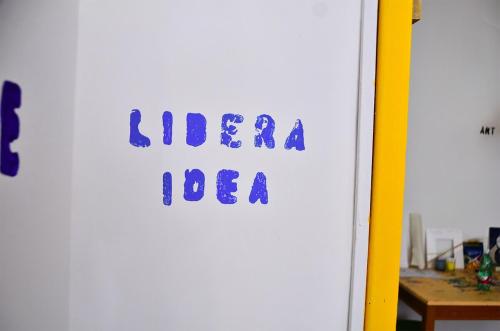 a white door with a sign that says alien idea at LIBERA IDEA Art run space in Civitanova Alta