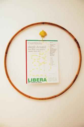 a sign on a hoop on a wall at LIBERA IDEA Art run space in Civitanova Alta