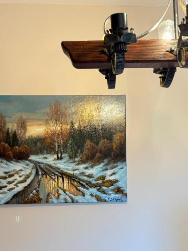 a picture of a painting of a winter train at Apartamenty Zloty Pociąg in Boguszów-Gorce