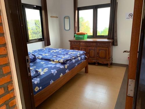 Ένα ή περισσότερα κρεβάτια σε δωμάτιο στο Villa Abah Enin