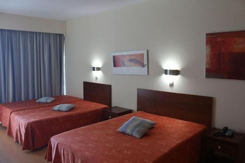 Postel nebo postele na pokoji v ubytování Hotel Dom Afonso - Monção