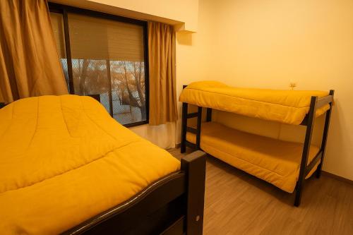Katil atau katil-katil dalam bilik di Quinba Hostel