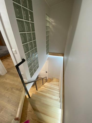 a staircase leading up to the second floor of a house at Heart of the old town in Kamianets-Podilskyi